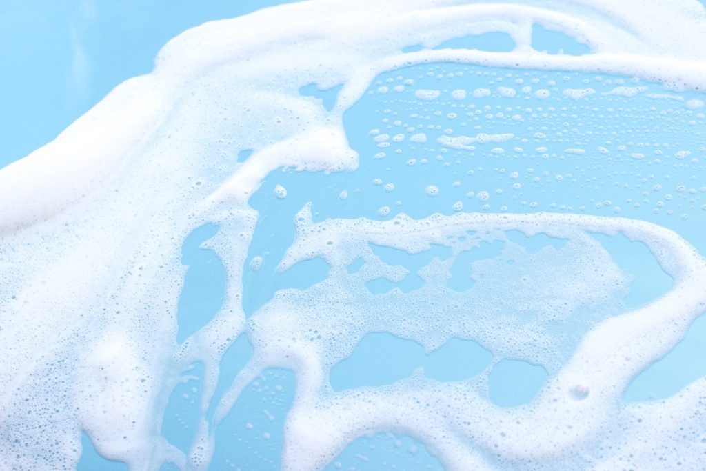 Blue foamy hot tub water