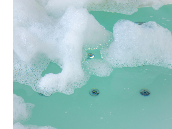 Hot tub with foam on the surface of the water
