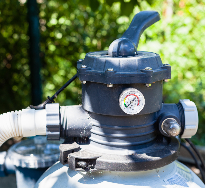 Photo of a gray pool pump surrounded by outdoor foliage