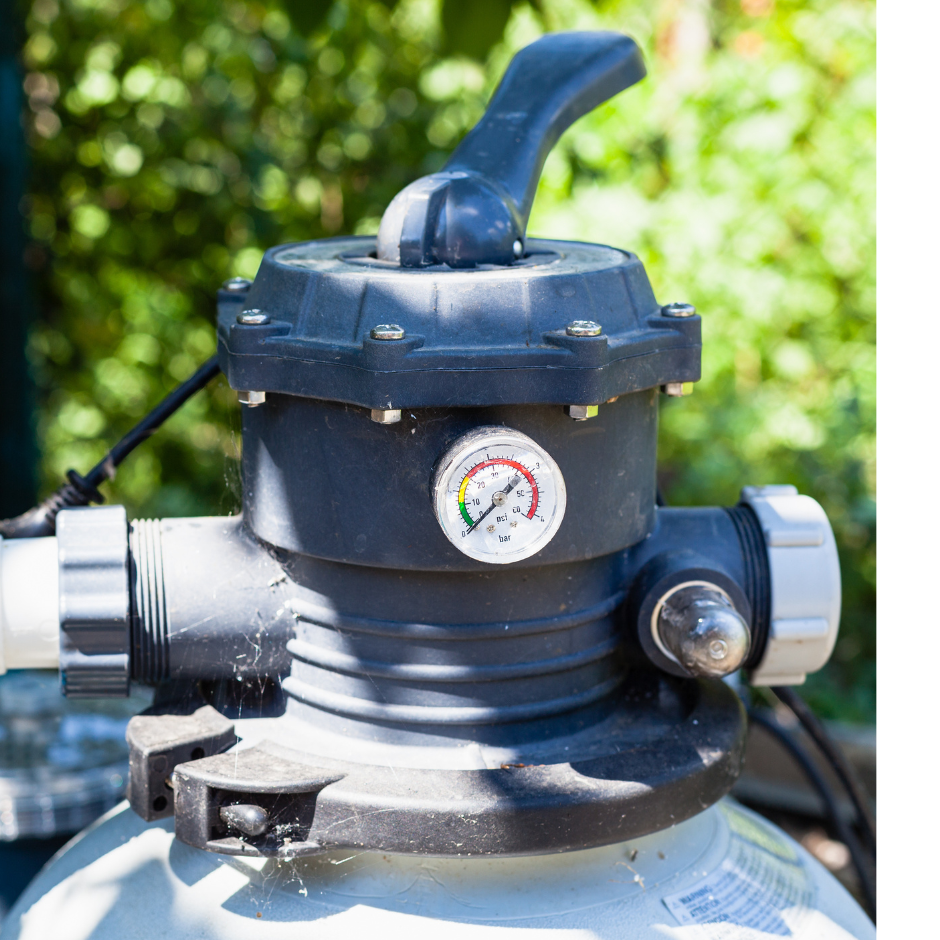 Photo of a gray pool pump surrounded by outdoor foliage