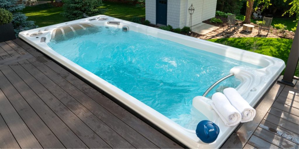 Swim Spa with FROG® @ease® Sanitizing System for Swim Spas on corner.